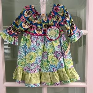 New handmade girls’ flannel dress in a size 18 months.